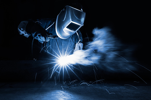Closeup industrial Worker at the factory welding