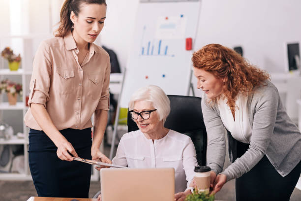 istock Happy aged business lady working in the office 639825470