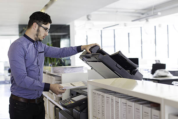 istock Businessman printing in the office. 639826260