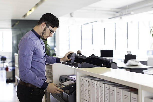istock Businessman printing in the office. 639826634
