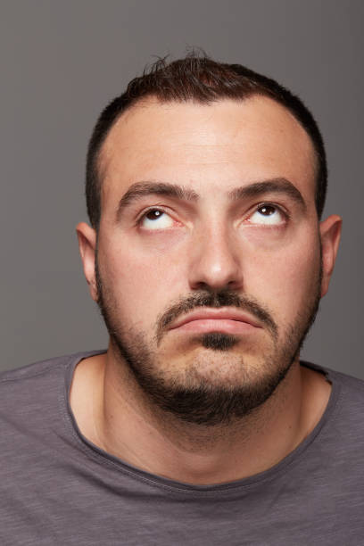 istock portrait of young bored man 639826706
