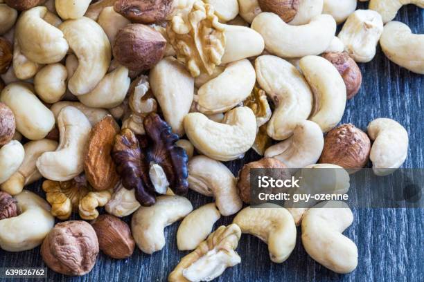 Mixture Of Dried Fruits On A Dark Background Stock Photo - Download Image Now - Amuse Bouche, Aperitif, Appetizer