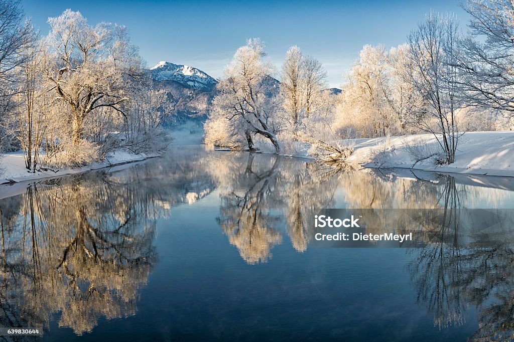 River Loisach entering Lake Kochel in Winter River Loisach flows into the Kochelsee, winter with rime and snow on the trees Winter Stock Photo