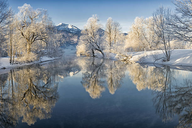 River Loisach entering Lake Kochel in Winter River Loisach flows into the Kochelsee, winter with rime and snow on the trees snowy river stock pictures, royalty-free photos & images