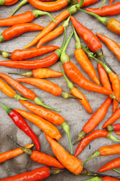 istock Red pepper on a wooden background 639831382