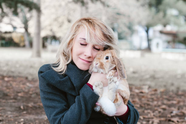 istock woman with rubbit, outdoor 639833062