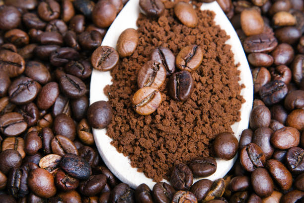 istock Instant coffee in spoon on coffee beans background 639836812