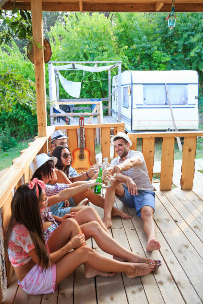 istock Friends sitting on veranda and drinking beer 639838198