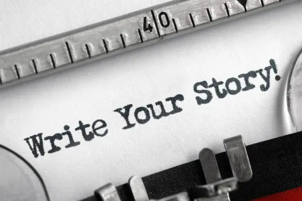Photo of Write your story written on typewriter