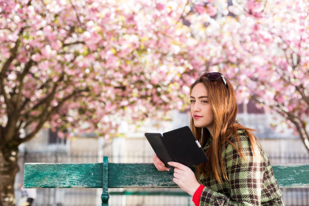 istock Book reading in the park 639839660