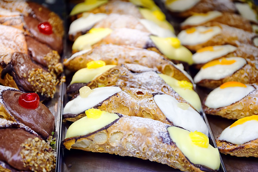 Cannoli series filled with white sweet ricotta. Typical Sicilian sweet, but famous and spread throughout Italy and the world.