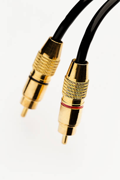 istock Black cinch audio cable with golden plugs over white 639841554