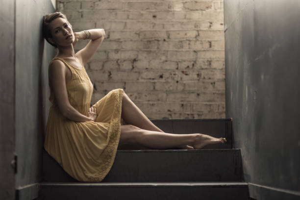 istock Beautiful Woman Resting in a Hallway 639843182