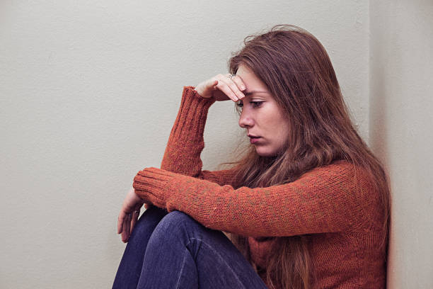 istock Lonely sad woman deep in thoughts 639844060