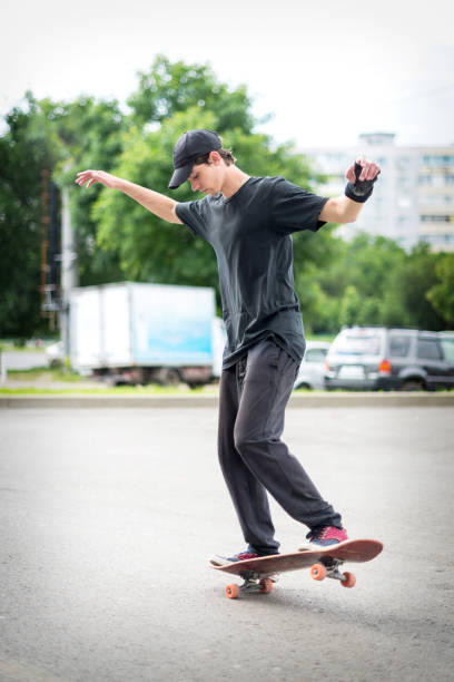 istock Teenage skateboarder standing 639844538
