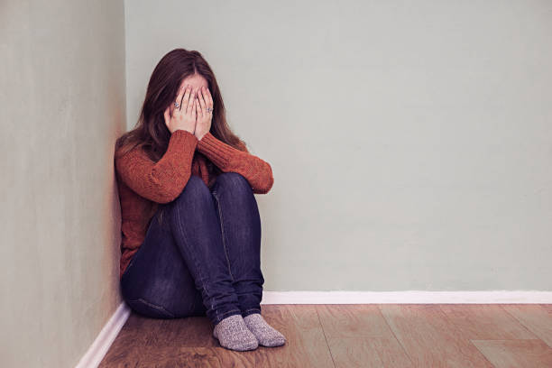 istock Woman sitting alone and depressed 639845254