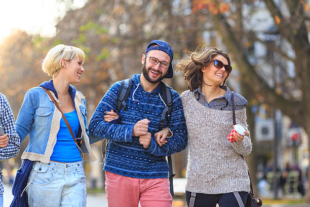 istock Friends walking on street and having fun 639845658