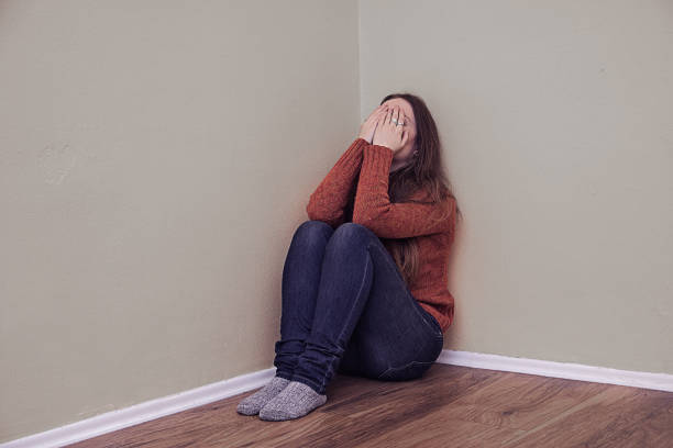 istock Woman sitting alone and depressed 639845870