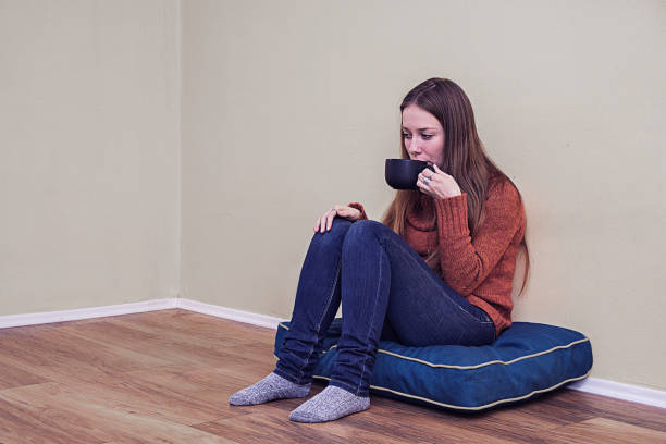 istock Worried woman holding coffee mug 639845974