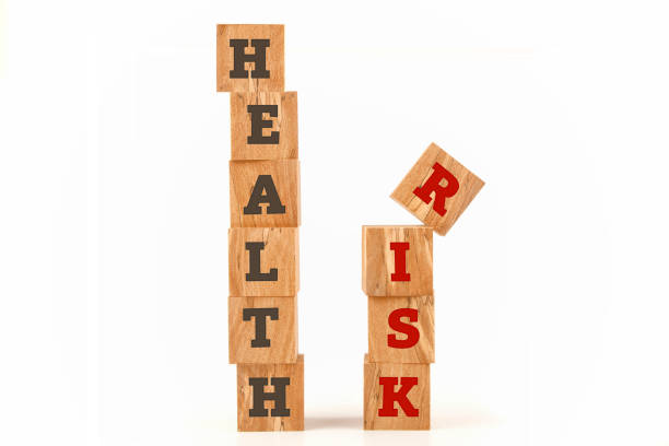 istock Health and Risk word written on cube shape 639845990