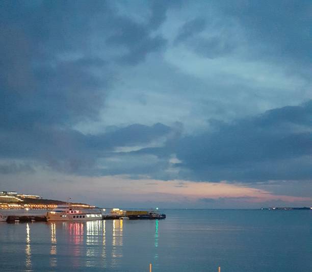 istock Multicolored lights on the sea 639849350