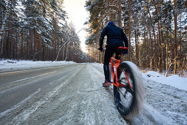 istock Bike ride on winter road 639851872