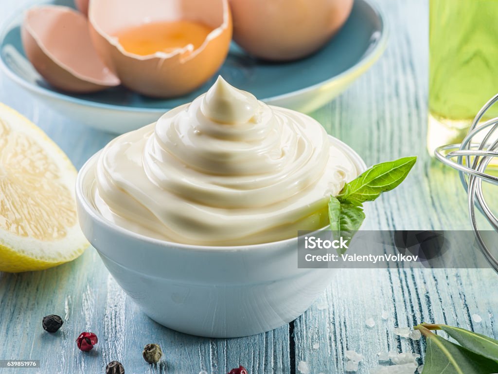 Mayonnaise ingredients and the sauce itself. Natural mayonnaise ingredients and the sauce itself. Mayonnaise Stock Photo