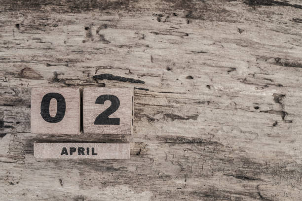 istock Cube calendar for april on wooden background 639853418