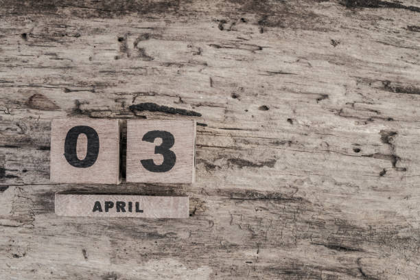 istock Cube calendar for april on wooden background 639853502