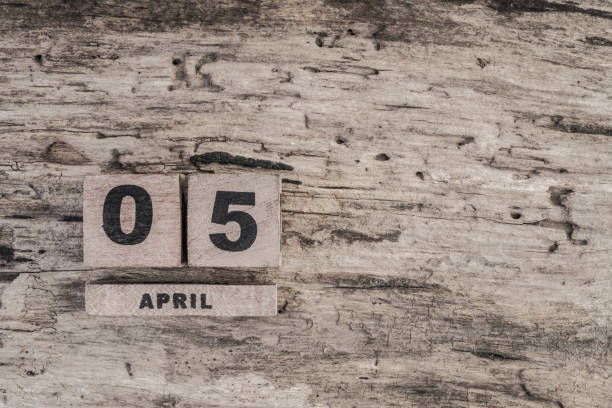 istock Cube calendar for april on wooden background 639853668