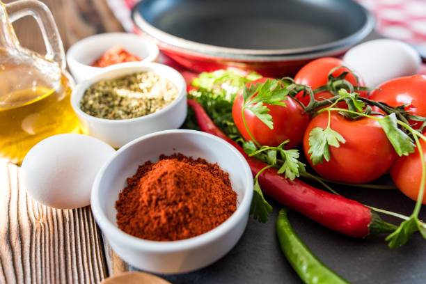 istock Frying Pan with Fresh Vegetables On Wooden Table 639853694