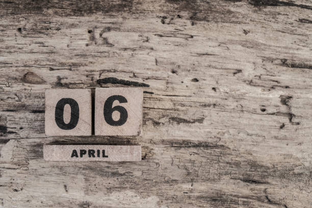 istock Cube calendar for april on wooden background 639853756