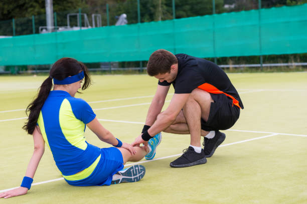 istock Man doing massage to his female tennis partner 639855742