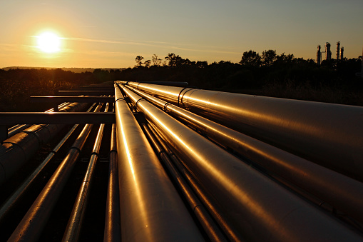 golden colour of  steel pipeline system during sunset