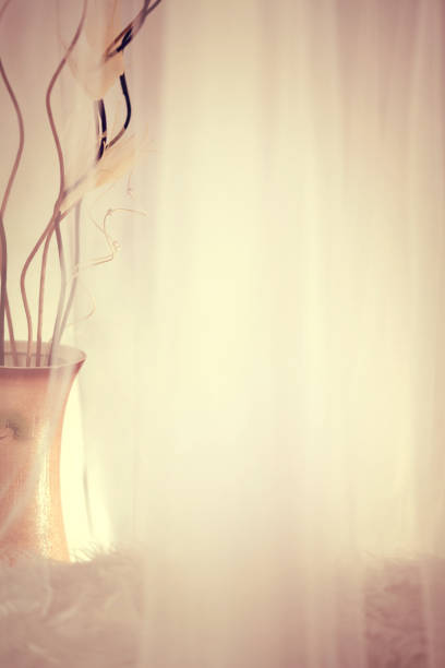 Sheer Voile with a large vase and artificial flowers