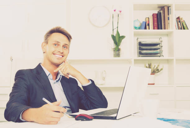 istock happy business employee at office 639862044