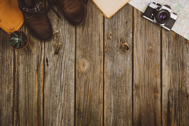 istock Travel accessories top view on wooden background with copy space 639865378