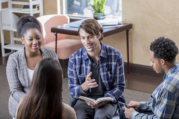 istock Cheerful mid adult man leads Bible study 639865430