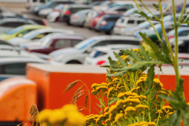 istock Blurry car park next to modern mall . Blurred background abstract 639865712
