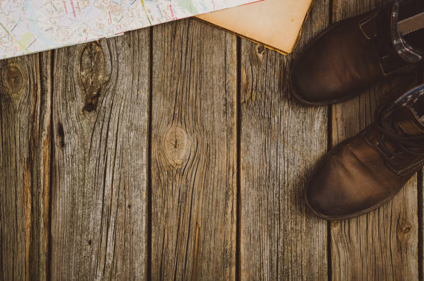 istock Travel accessories top view on wooden background with copy space 639865722