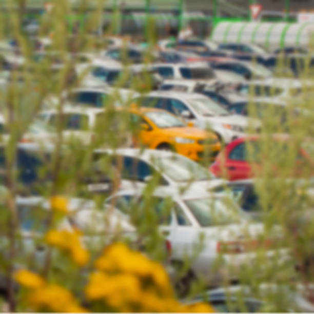 istock Blurred parking lot next to shopping center. For background abstract 639865782