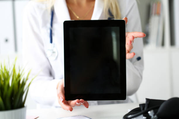 istock Female doctor holding digital tablet pc 639866356