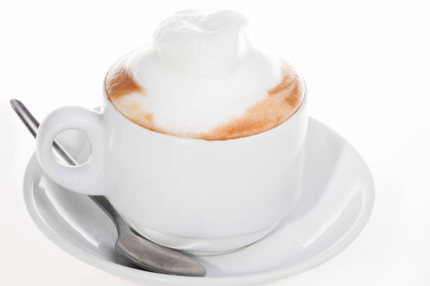 istock Coffee mug with milk and spoon 639869558