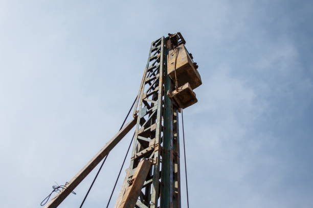 istock Crane and building construction site with blue sky 639871960
