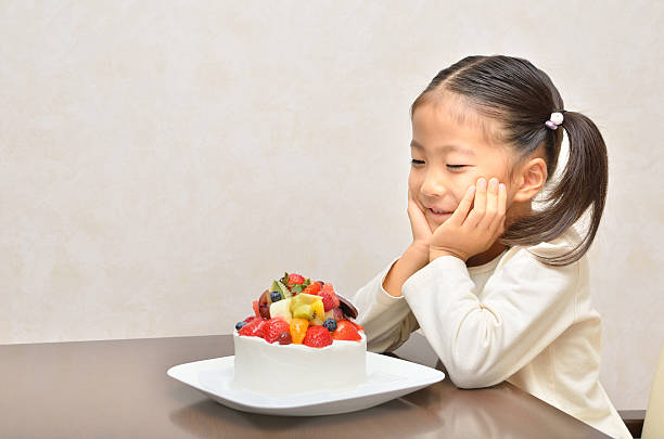 istock Japanese girl with cake and gift 639874834