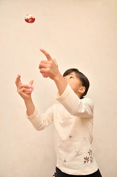 istock Japanese girl playing with Otedama 639876888
