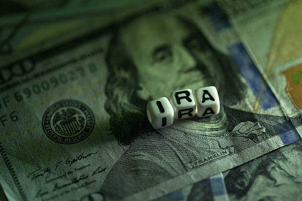 istock IRA cubic letter on dollar money surface 639877788