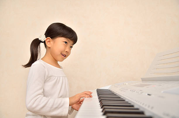 istock Japanese girl playing musical instrument 639877876
