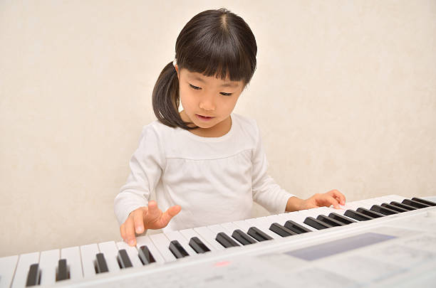 istock Japanese girl playing musical instrument 639877920