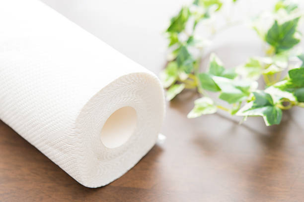 Roll of paper towel on wooden background Kitchen paper. paper towel photos stock pictures, royalty-free photos & images